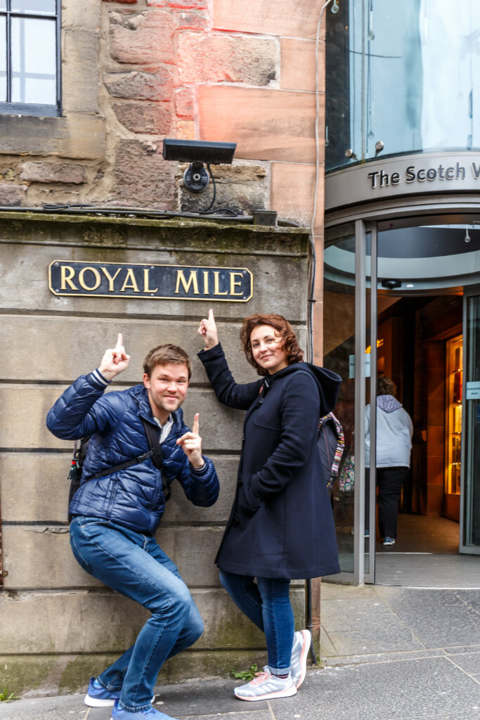 Couple in old center of Edinburgh in spring